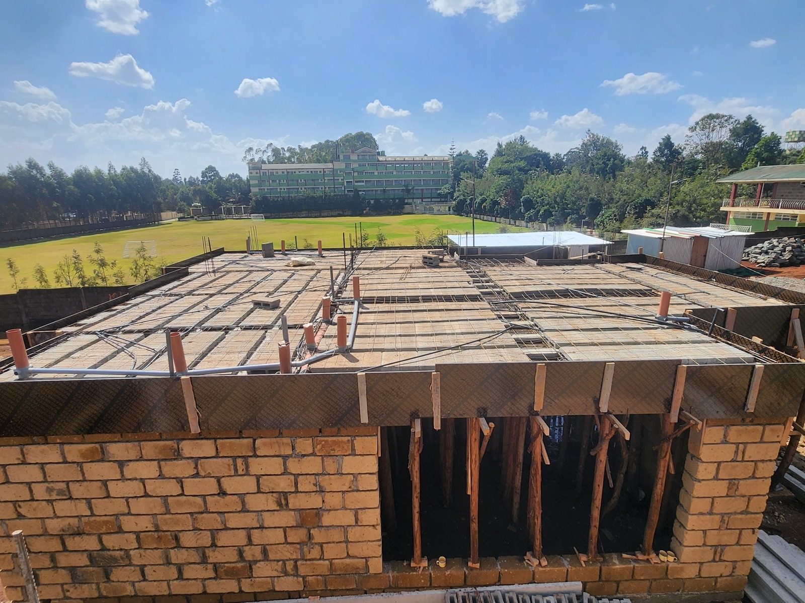 Concrete pouring and structural curing on the first-floor suspended slab