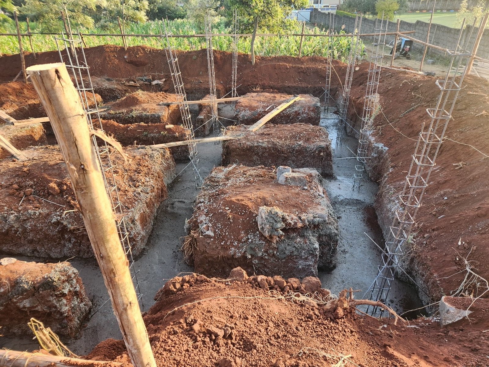 Foundation excavation, blinding concrete, and column starter rebar pouring in Gikambura