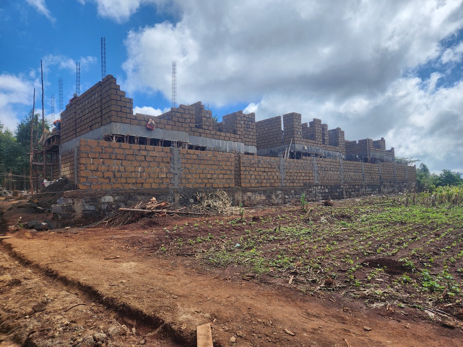 Upper floor structural masonry and column casting progress at Gikambura Town Houses
