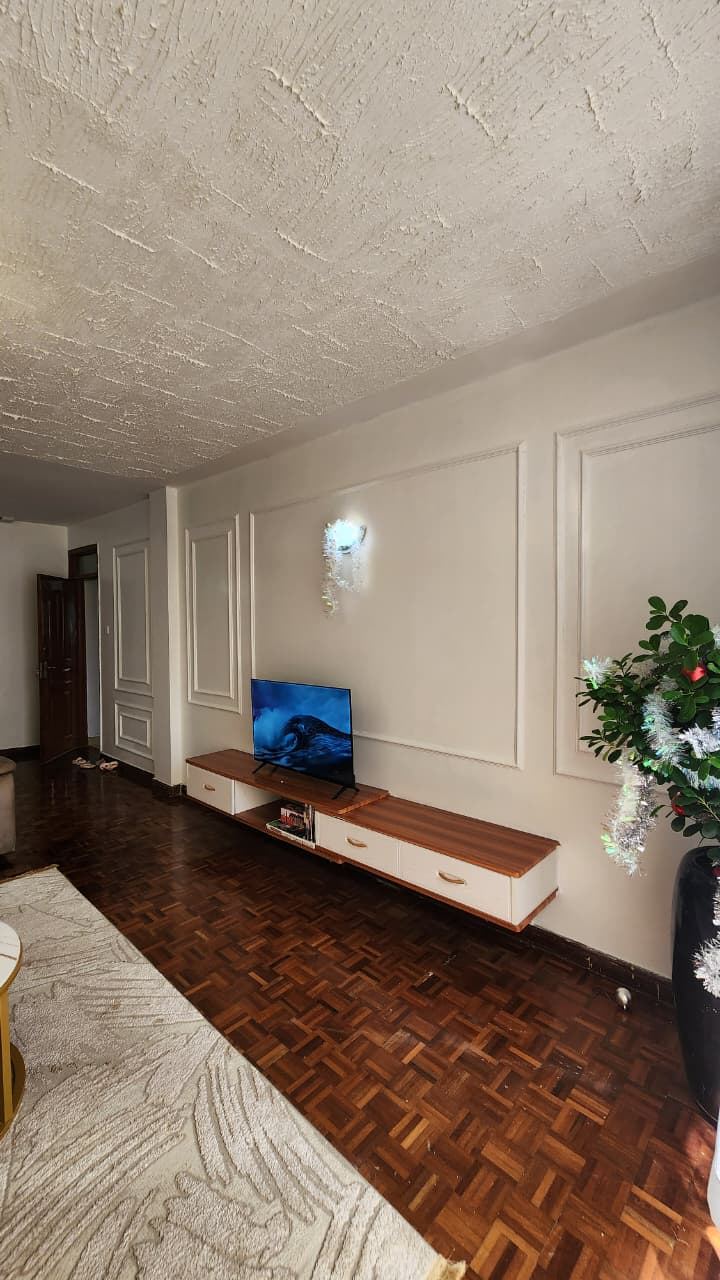 Completed wainscoting lounge wall with parquet flooring at a Kiambu residence